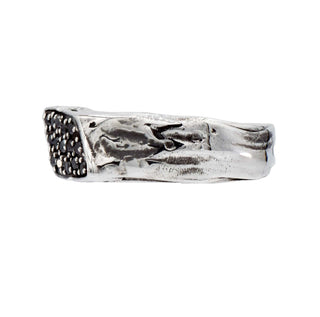 Karen Karch silver Signet Wrap ring studded with black diamonds, side view on a white background.