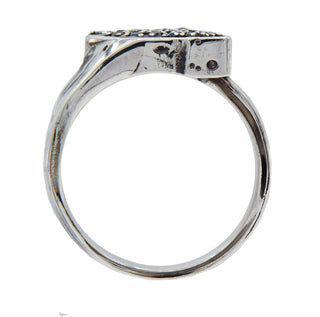 Karen Karch silver Signet Wrap ring studded with black diamonds, top view on a white background.