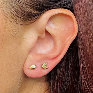 Karen karch by Deme Wolfe 10k yellow gold Breakthrough mismatched studs arrow head and back earrings on the ear