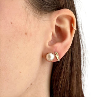 Karen Karch by Deme Wolfe Mystical Crown 10k yellow gold stud earrings featuring lustrous white freshwater pearls styled with mini wing stud on ear.