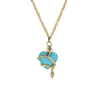 Karen Karch by Deme Wolfe Back Side of Serpentine Love Turquoise Heart embraced by a 10k yellow gold snake on a gold filled chain on a white background.
