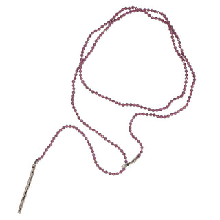 A faceted garnet and silver lariat with a weathered texture closure by Karen Karch
