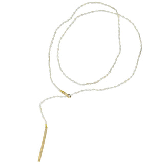 A white rice pearl and 10k yellow gold  lariat with a weathered texture closure by Karen Karch