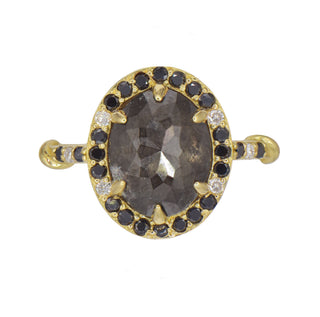 Karen Karch Gold Regal Ring with a natural grey diamond rose cut oval diamond surrounded by a halo of black and white diamonds on a white background