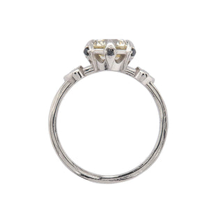 Karen Karch Invincible Crown Platinum Old European Diamond Ring with a black diamond in each claw and small side stones, top view, on white background.