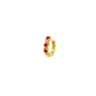 Karen Karch Yellow Gold huggie hoop earrings with rubies half pair on a white background.