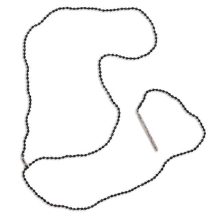 A black spinel silver lariat necklace with a weathered texture closure, featuring a loop and a pull-through bar.