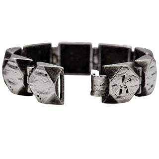 Karen Karch Silver Outshine 16mm wide bracelet with geometric square faceted corner with logo clasp shown open.