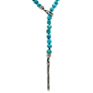 Close up of silver weathered texture loop and a pull-through bar closure on Turquoise Cube necklace by Karen Karch