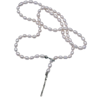 A white freshwater pearl and silver lariat with a weathered texture closure by Karen Karch