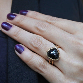 KAREN KARCH INTRIGUE CROWN Black Diamond 18k Rose Gold Ring on a hand. 
