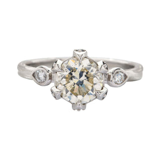 Karen Karch Invincible Crown Platinum Old European Diamond Ring with small side stones on white background.