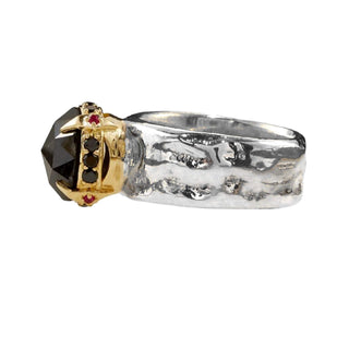 Karen Karch Kind of Rings Mixed Metal with a large rose cut black round black diamond in an 18ky setting on a wide silver band, side view.