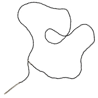 A black spinel silver lariat necklace with a weathered texture closure, featuring a loop and a pull-through bar.