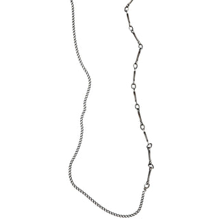 Close Up of a Karen Karch by Deme Wolfe Mystical Bling Silver chain necklace featuring two different chain styles merged displayed against a white background.