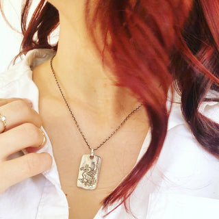 Karen Karch Silver Dragon Legend Tag with Vine Bail on chain on model
