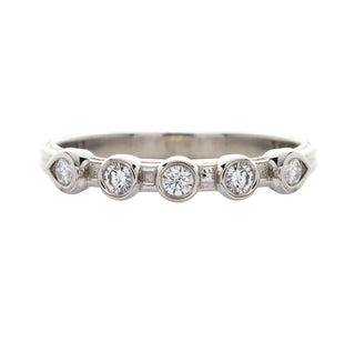 Karen Karch Turned Out Grace Platinum Weathered Band with 5 bezel set diamonds, the end 2 beazels are pear shape, on white background